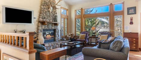 Spacious Living Room with Wood Burning Fireplace and Views of Beaver Creek Mountains!