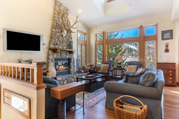 Spacious Living Room with Wood Burning Fireplace and Views of Beaver Creek Mountains!
