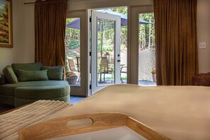 Bedroom with door access to outside area