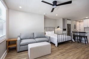 The studio features a sleeper sofa and a queen bed - sleeps 4!