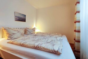 Fewo 24 Residenz Meeresbrandung Duhnen - Schlafzimmer mit Doppelbett