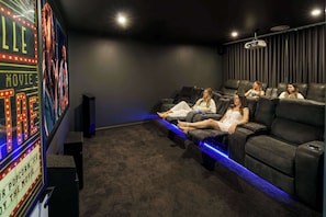 A luxury cinema room offers laid back comfortable seating for 8 guests