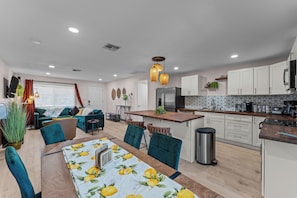 Welcome to the heart of our stylish retreat! Our living room exudes comfort and modern charm, featuring plush furnishings and contemporary decor.