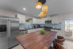 With ample seating and a stylish ambiance, this space is perfect for enjoying home-cooked meals or takeout from local eateries.