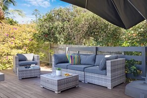 Rear patio area with outdoor furnishings + gas bbq
