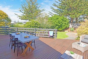 Rear patio area with outdoor furnishings + gas bbq
