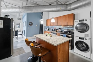 Kitchen area with bar stools