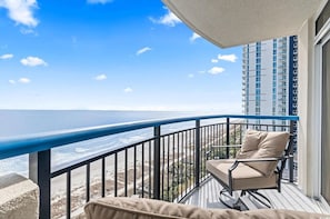 Oceanfront balcony with seating area