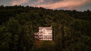 Secluded getaway perched on the edge of nature and surrounded by trees.