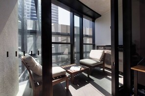 A covered balcony creates a sunny spot to enjoy your morning coffee or perhaps an afternoon wine.