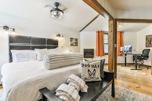 Main Bedroom, king size mattress medium firm, double sliding door access to back deck. Features an office nook in the corner, desk is height adjustable, so is the chair. Larger display for tired eyes. Blackout curtains for a deep nights sleep.