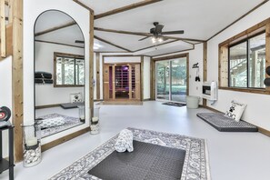 Basement level with full bath and walk in shower, sauna, zero gravity chairs, yoga, weights, bench and exercise bike.