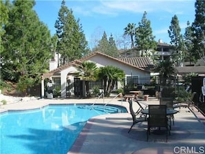 One of two swimming pools. Clubhouse in the background.