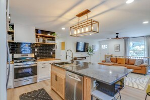 Step into comfort: Our spacious living room and open-concept kitchen!