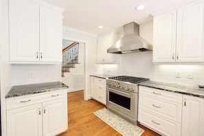Kitchen- Gas stove, stainless steel appliances, granite countertops