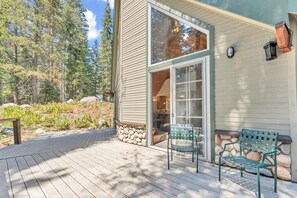 Exterior: Deck, outdoor chairs, serene forest surroundings