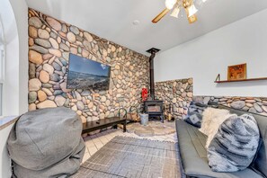 Bonus Room: Futon, wood-burning fireplace, 50” Smart TV, lower floor