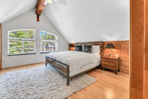 Bedroom 1: King bed, dresser, upper floor