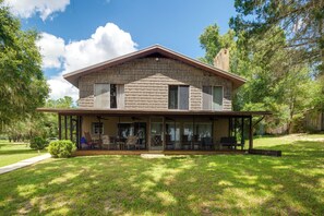 Property Exterior | Screened-In Porch | Spacious Yard