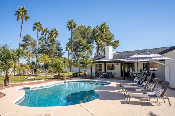 Pool view with pool lounge chairs