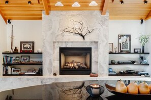 Gas fireplace with easy thermostat control located on the wall
