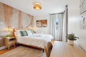 Beautiful Bedroom with a Comfortable QUEEN size bed and peaceful view to the backyard. 