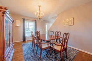 Formal dining room equipped with seating for 6 people.