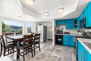 Enjoy the breathtaking mountain views from the kitchen and dining table.