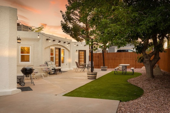 A large backyard space is the perfect place to relax and enjoy the fresh air and the beauty of the surrounding mountains.