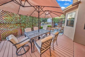 Comfortable Outdoor Dining With Starlight Umbrella And Plenty Of Other seating Options