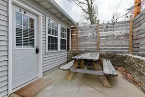 This is the entryway with a picnic table; a great setup for outdoor grilling!