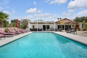 Panoramic view of the sun loungers by the pool, to the patio and Al Fresco dining area