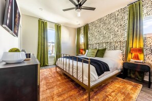 Master bedroom with ensuite bathroom and TV