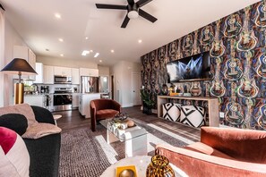 Open concept living area with TV