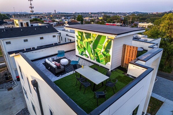 Private rooftop deck with seating and photo op