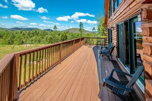 Enormouse Wrap around Porch accessed by 2 French Doors with Seating for 15 overlooking 40+ Mnt Peaks