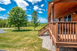 Enormous Covered Porch overlooking yard & Mnts.