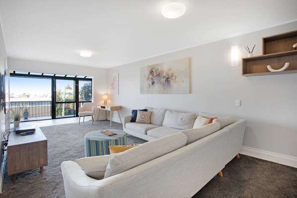 Relax on the couch and enjoy the view over the city.