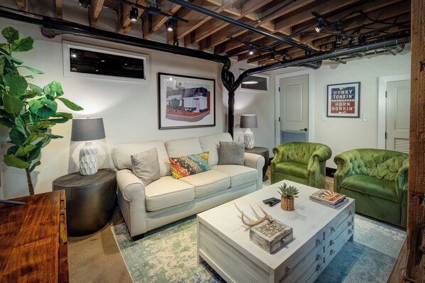 Cozy and spacious living area with TV