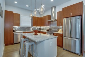 Kitchen with toaster, coffee maker, blender, and more