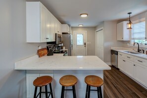 Kitchen bar counter with seating for 3