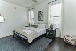 The stylish bedroom retreat boasts a plush king bed & smart TV