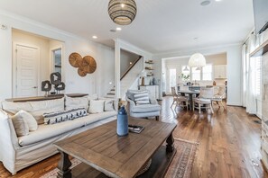 Radiant living area with plush seating, a cozy gas fireplace, and a Smart TV