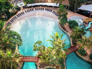 A communal lagoon pool offers the perfect spot to cool down with a dip or relax on the sun loungers, complete with a children’s slippery dip and play area. 
