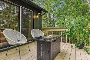 Enjoy good conversation around the cozy propane firepit!