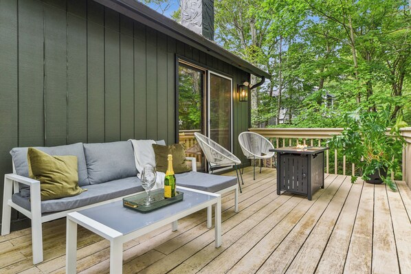 Experience a tree-house vibe hanging out on the expansive elevated deck.