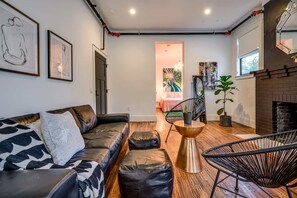 Suite 103 – The Accessible 1st Floor Chandelier Canopy Suite offers a King and Queen Casper Bed, Smart TV, and private Bathroom