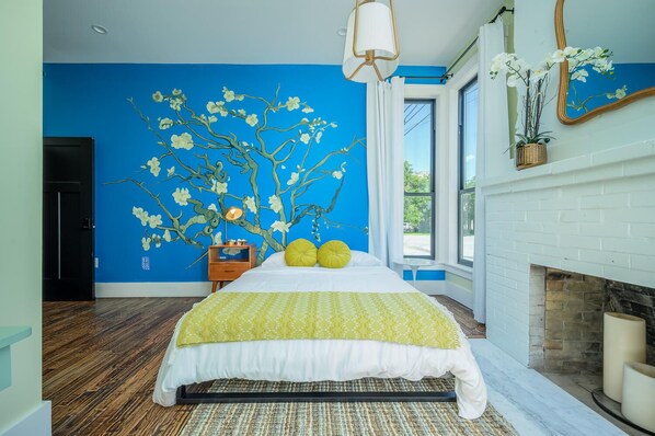 Suite 101 – The 1st Floor Van Gogh Suite boasts a Casper King Bed, Smart TV, and private En Suite with Claw-Foot Tub
