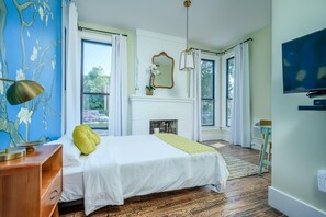 Suite 101 – The 1st Floor Van Gogh Suite boasts a Casper King Bed, Smart TV, and private En Suite with Claw-Foot Tub