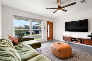 Curl up in the stylish living room & stream all your favorite entertainment